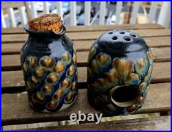 2 Jim Fineman ceramic pieces. Peacock Pitcher (5) and tea light cand holder(4)