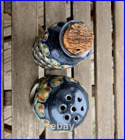 2 Jim Fineman ceramic pieces. Peacock Pitcher (5) and tea light cand holder(4)