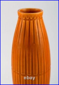 Bo fajans, Sweden. Vase in glazed ceramics with ribbed body