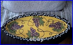 Signed pottery plater 20.5 Inch Iong