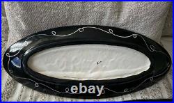 Signed pottery plater 20.5 Inch Iong